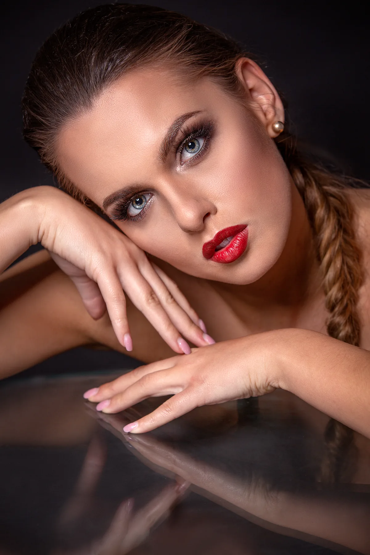 Social make-up with expressive eyes and red lipstick.